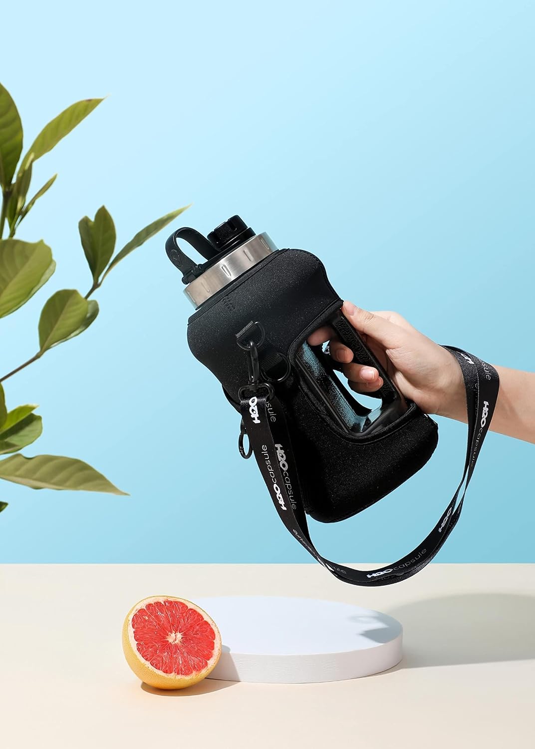 H2O Capsule 2.2L Half Gallon Wide Mouth Water Bottle with Storage Sleeve and Removable Straw - Hydration Tracker Jug with Measurements Marked – Shatterproof BPA-Free, (Jet Black)