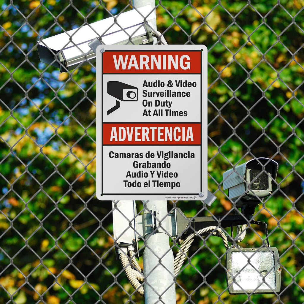 SmartSign-S-9392-AL-14 Warning - Audio & Video Surveillance On Duty At All Times Bilingual Sign By | 10" x 14" Aluminum - Black/Red on White
